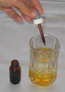 iodine dropper into a glass of water